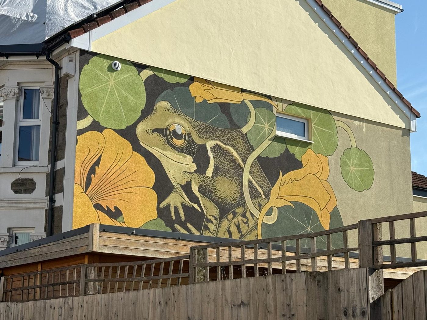 A painted mural of a frog.